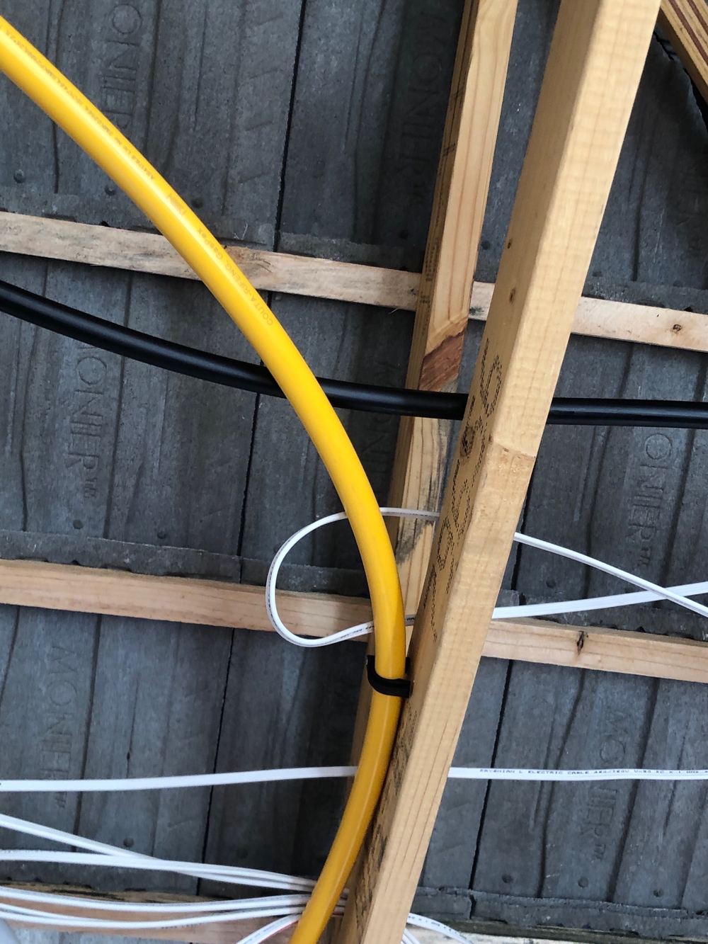 Cables touching gas pipes inside a lock-up frame