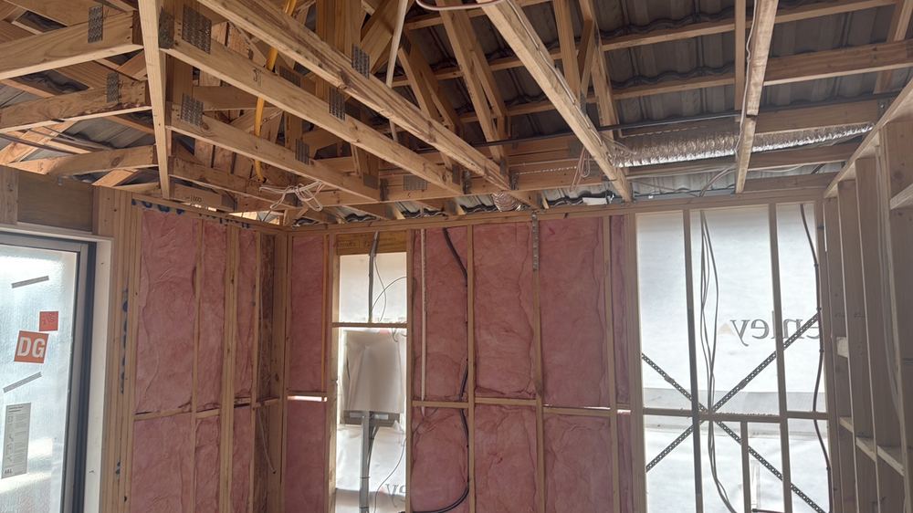Partially completed ceiling insulation, recorded on a lock-up inspection in Fraser Rise