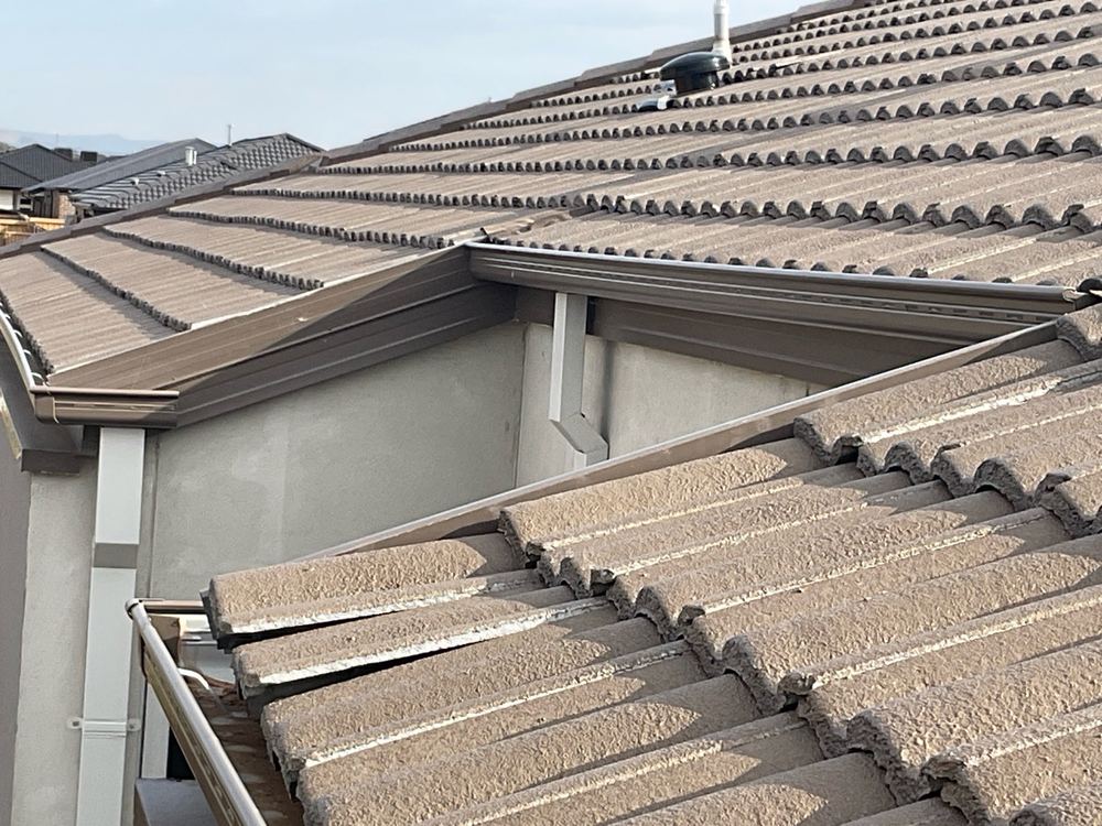 Roof tile out of position, recorded on a pre-handover inspection in Fraser Rise
