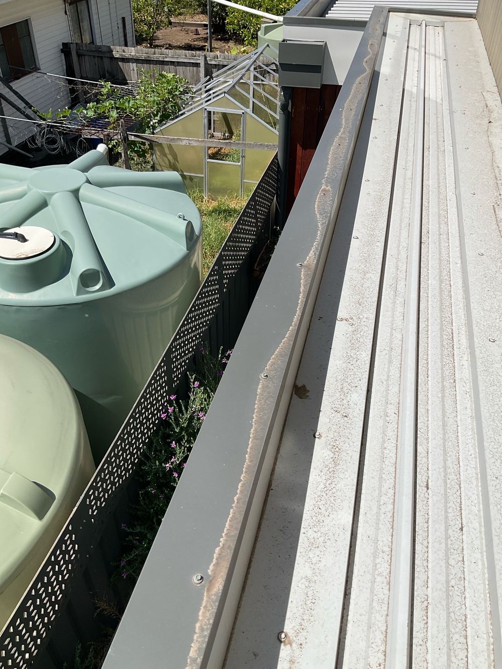 Water ponding on a roof, recorded on a building and pest inspection in Maidstone
